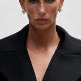 Luna Fern Earrings shown in a lifestyle setting, full length view