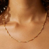 Luna Twist Necklace shown in a lifestyle setting