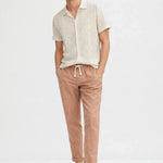Malé - Short-Sleeved Set shown in a lifestyle setting, full length view