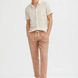 Malé - Short-Sleeved Set shown in a lifestyle setting, full length view