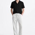 Malé - Short-Sleeved Set shown in a lifestyle setting, side angle view