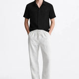 Malé - Short-Sleeved Set shown in a lifestyle setting, side angle view