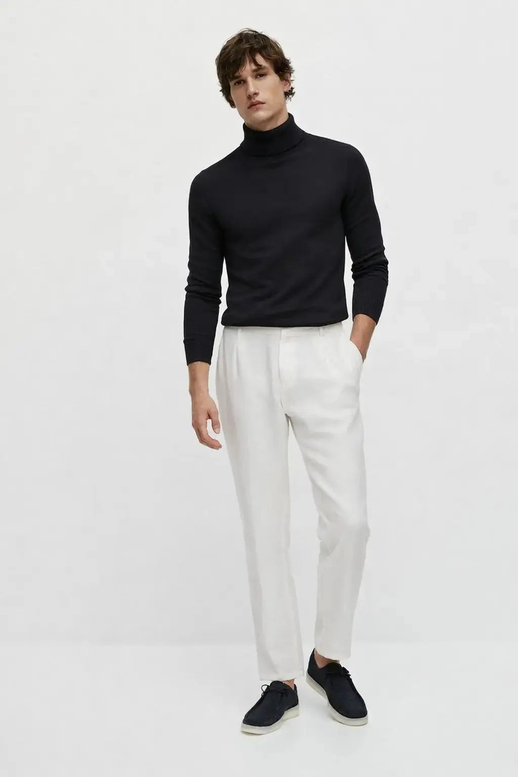 Merino Royal Turtleneck shown in a lifestyle setting, alternate view
