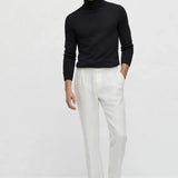 Merino Royal Turtleneck shown in a lifestyle setting, alternate view