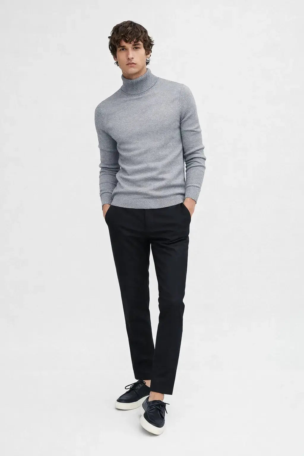 Merino Royal Turtleneck shown in a lifestyle setting, full length view