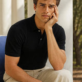 Black Cotton Polo Shirt shown in a lifestyle setting
