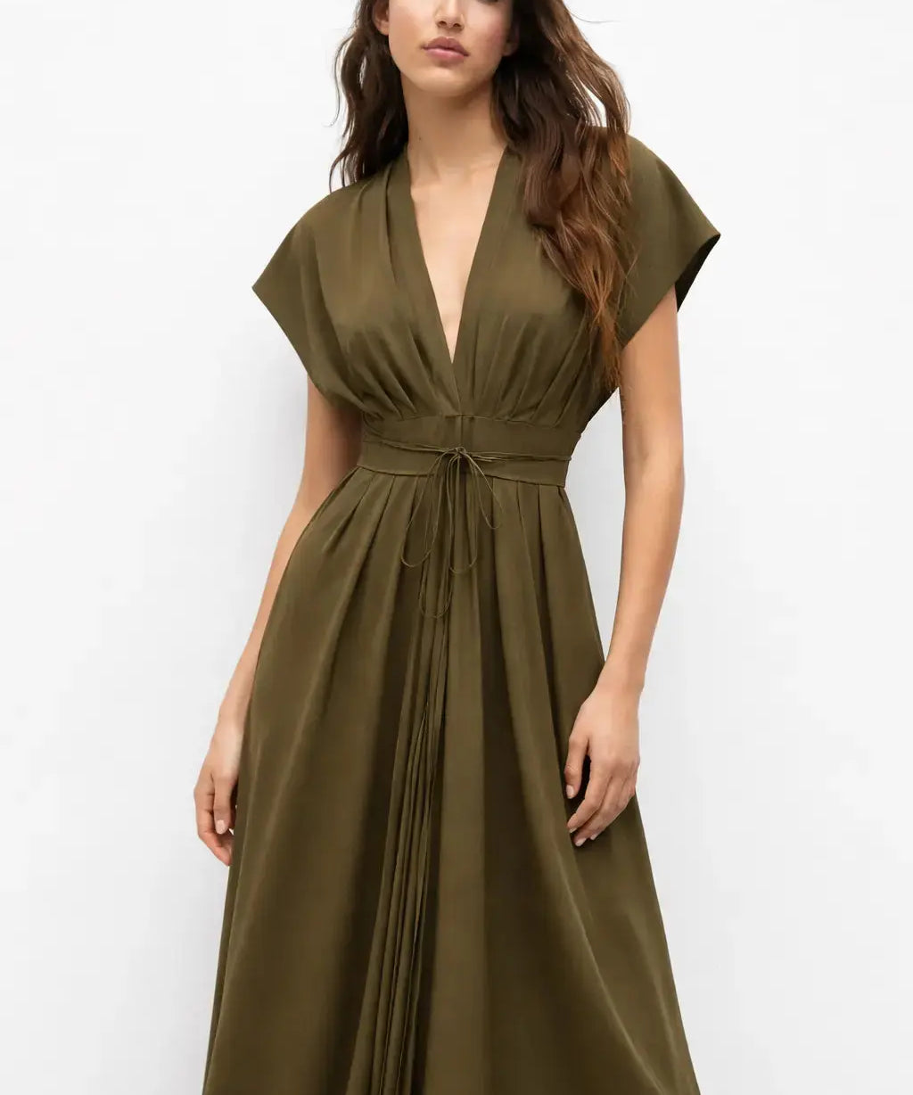 Olive Reverie Dress shown in a lifestyle setting