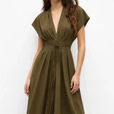 Olive Reverie Dress shown in a lifestyle setting