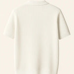 Ribb Polo shown in a lifestyle setting, cropped view