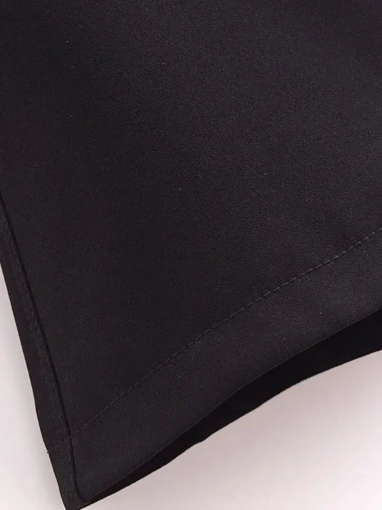 Close-up detail of Roselle Cape, fabric detail