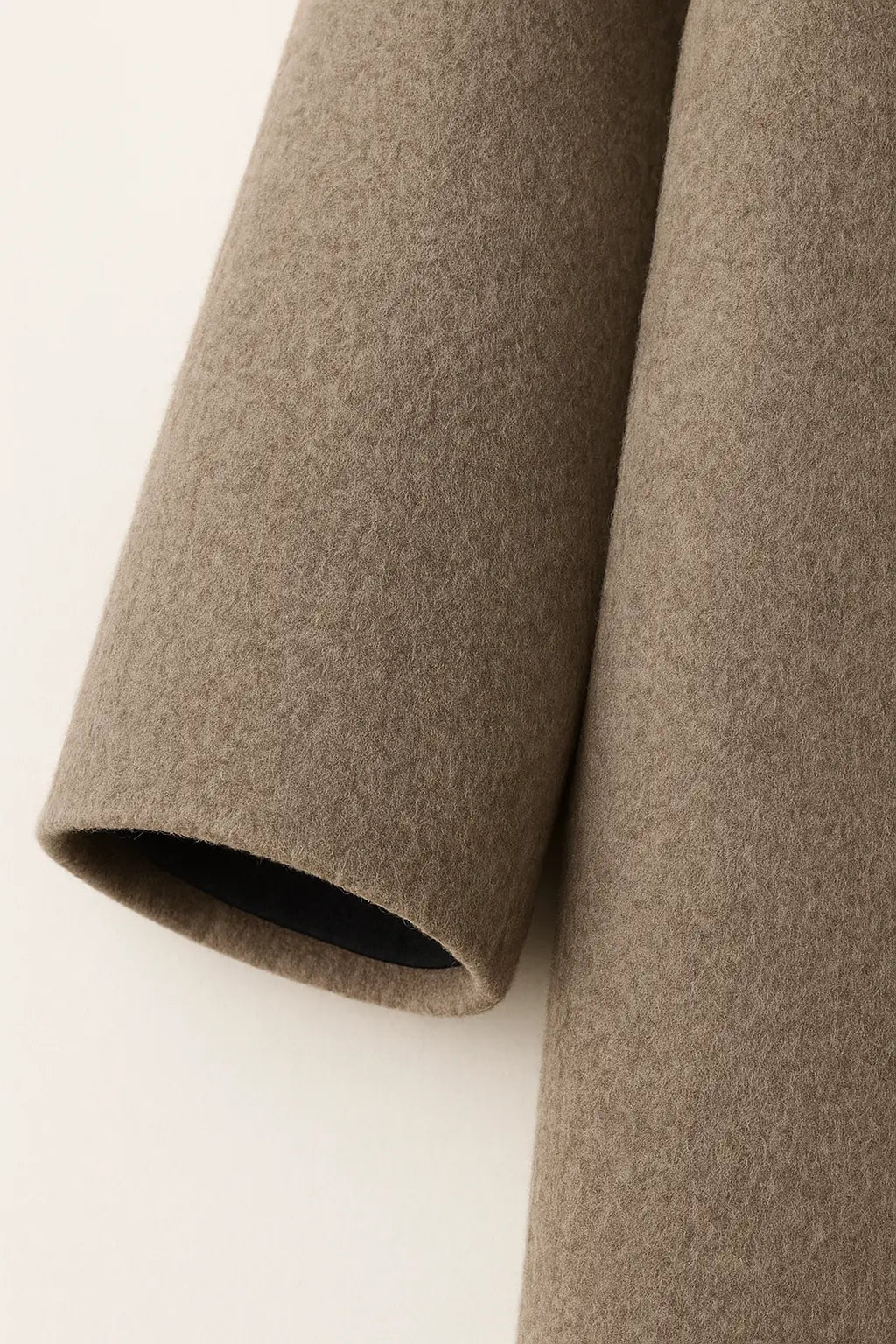 Close-up detail of Sandrelle Coat, fabric detail