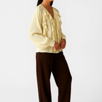 Sheer Blouse shown in a lifestyle setting, full length view