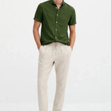 Short Sleeve Stand Collar Shirt & Straight Leg Linen Pants shown in a lifestyle setting, back angle view