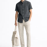 Short Sleeve Stand Collar Shirt & Straight Leg Linen Pants shown in a lifestyle setting, cropped view