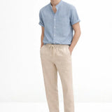 Short Sleeve Stand Collar Shirt & Straight Leg Linen Pants shown in a lifestyle setting, full length view