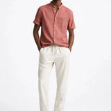 Short Sleeve Stand Collar Shirt & Straight Leg Linen Pants shown in a lifestyle setting, side angle view