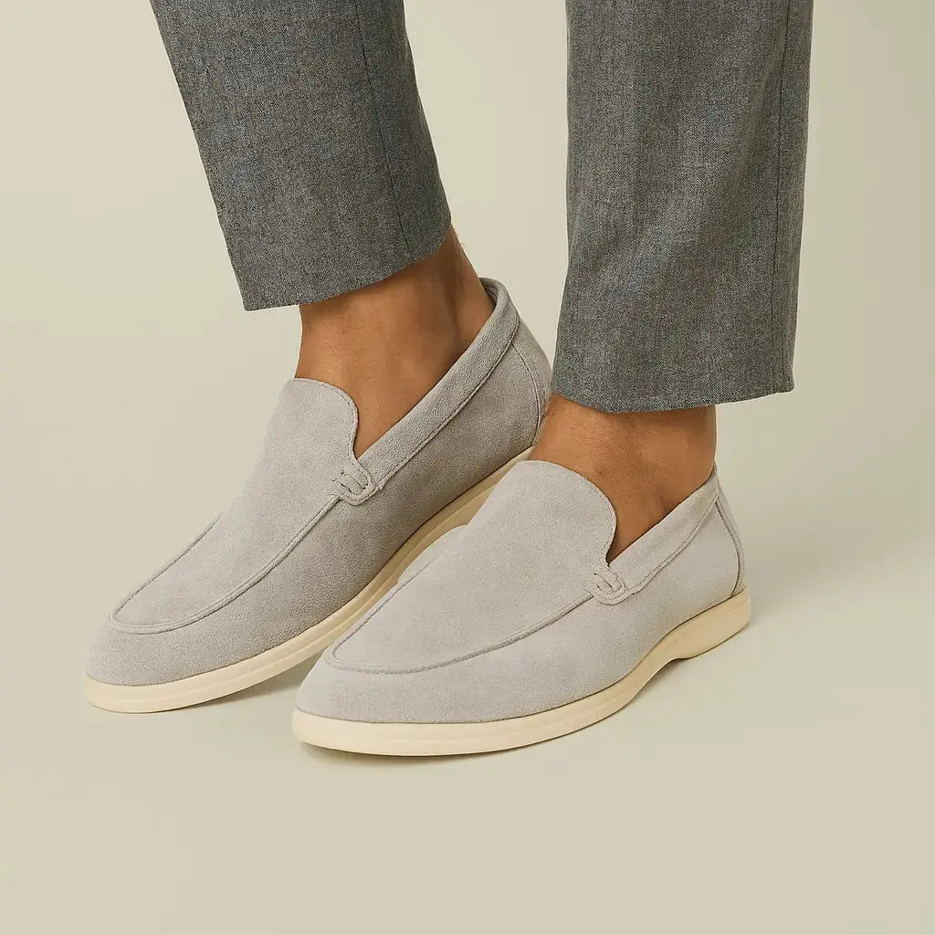 Close-up detail of THE CAPRICE SUEDE LOAFERS, trim detail