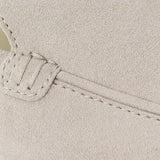 THE CAPRICE SUEDE LOAFERS shown in a lifestyle setting, cropped view