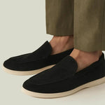 THE CAPRICE SUEDE LOAFERS shown in a lifestyle setting, full length view