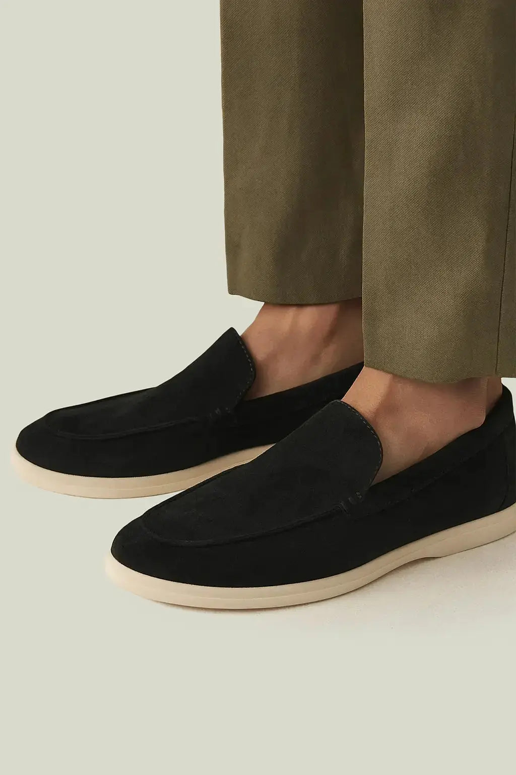 THE CAPRICE SUEDE LOAFERS shown in a lifestyle setting, full length view