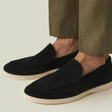 THE CAPRICE SUEDE LOAFERS shown in a lifestyle setting, full length view