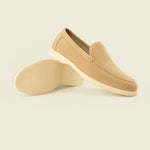 THE CAPRICE SUEDE LOAFERS shown in a lifestyle setting, side angle view