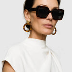 UltraLux Vision Sunglases shown in a lifestyle setting, alternate view